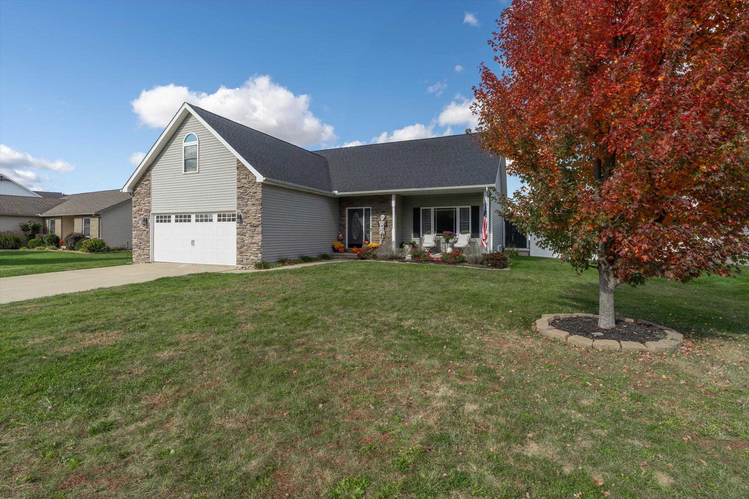 408 Coyote Trail Kouts, IN 46347 - Photo 2 of 36 a front view of house with yard and green space