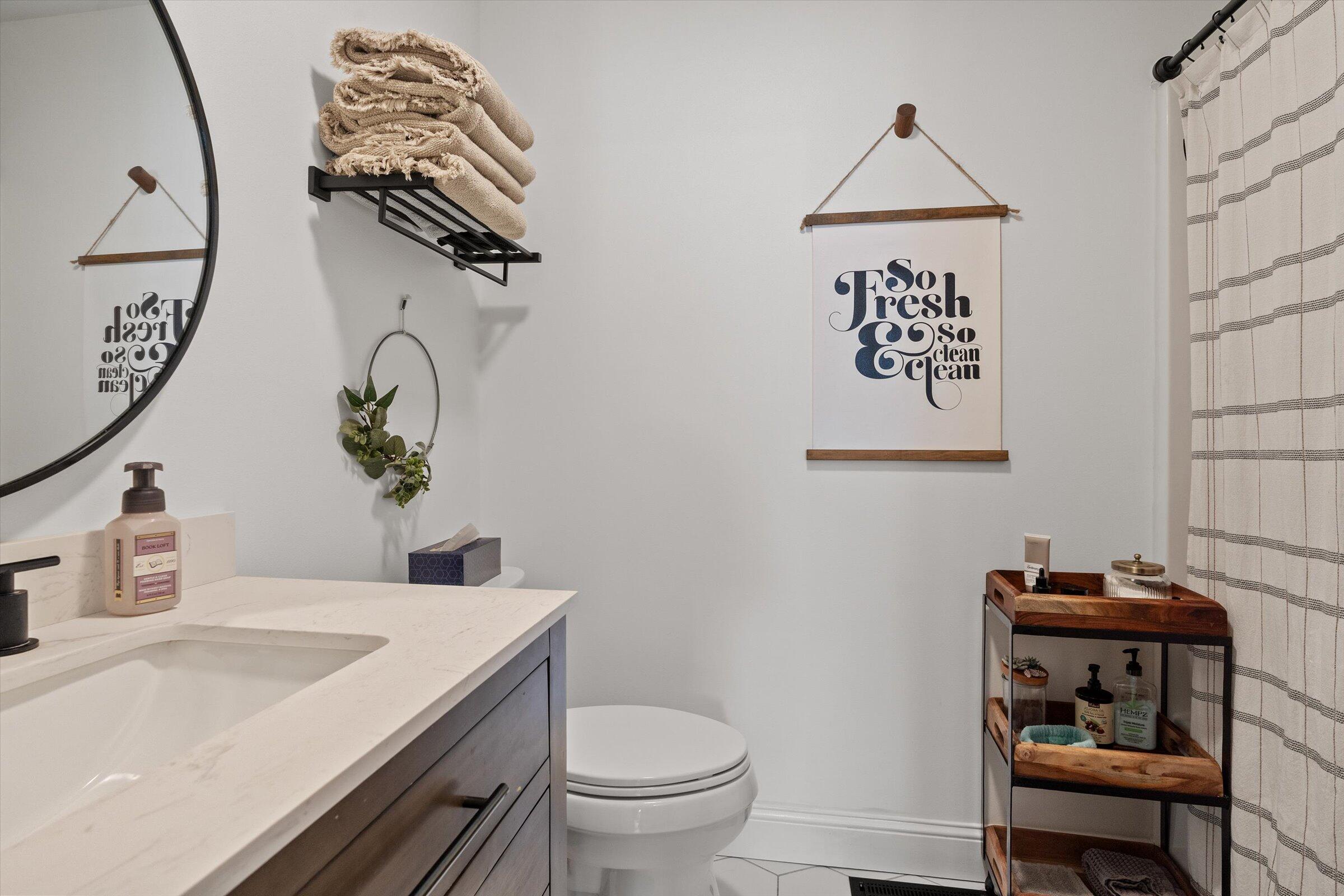 408 Coyote Trail Kouts, IN 46347 - Photo 28 of 36 a bathroom with a toilet and a sink