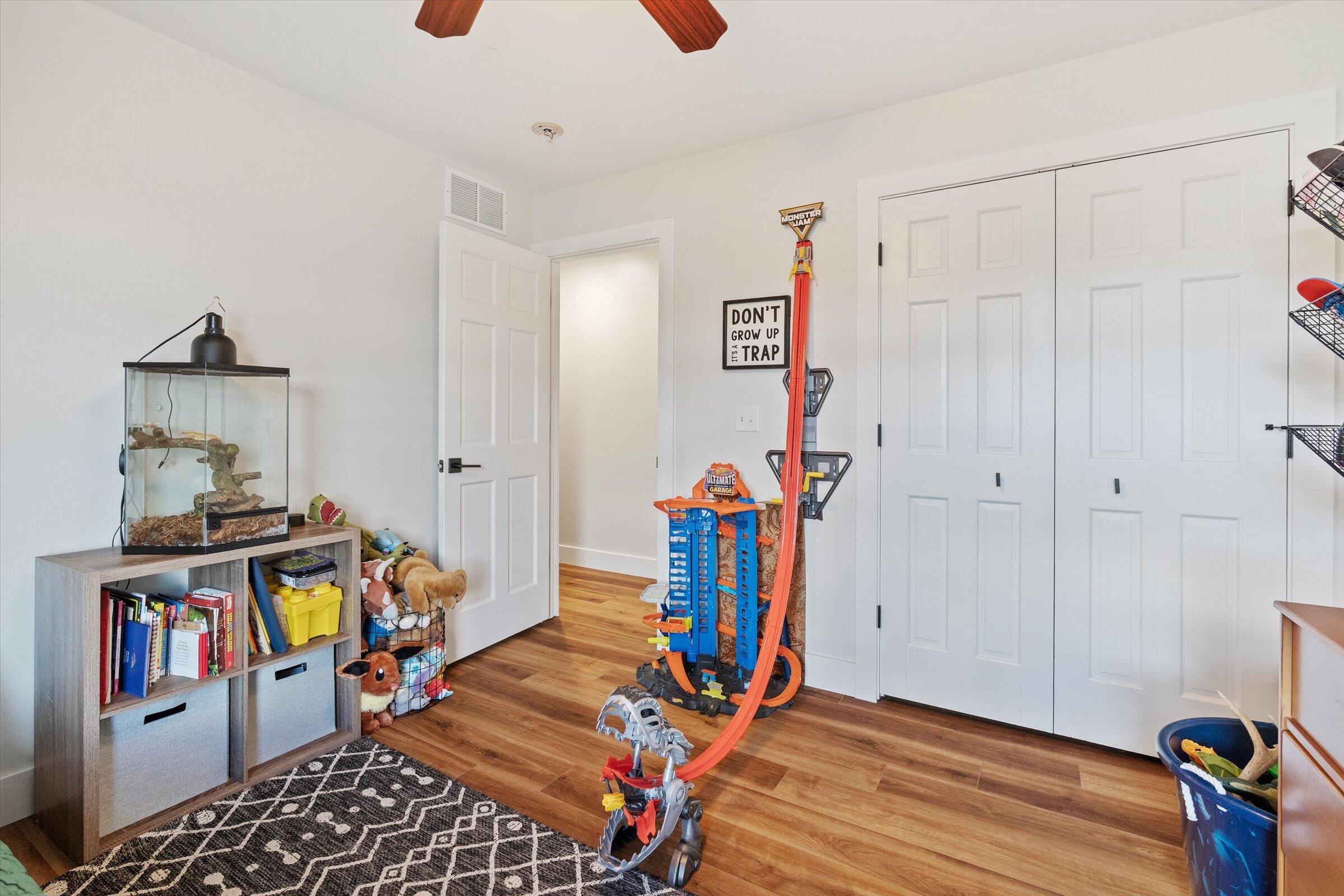408 Coyote Trail Kouts, IN 46347 - Photo 31 of 36 a room with furniture and wooden floor