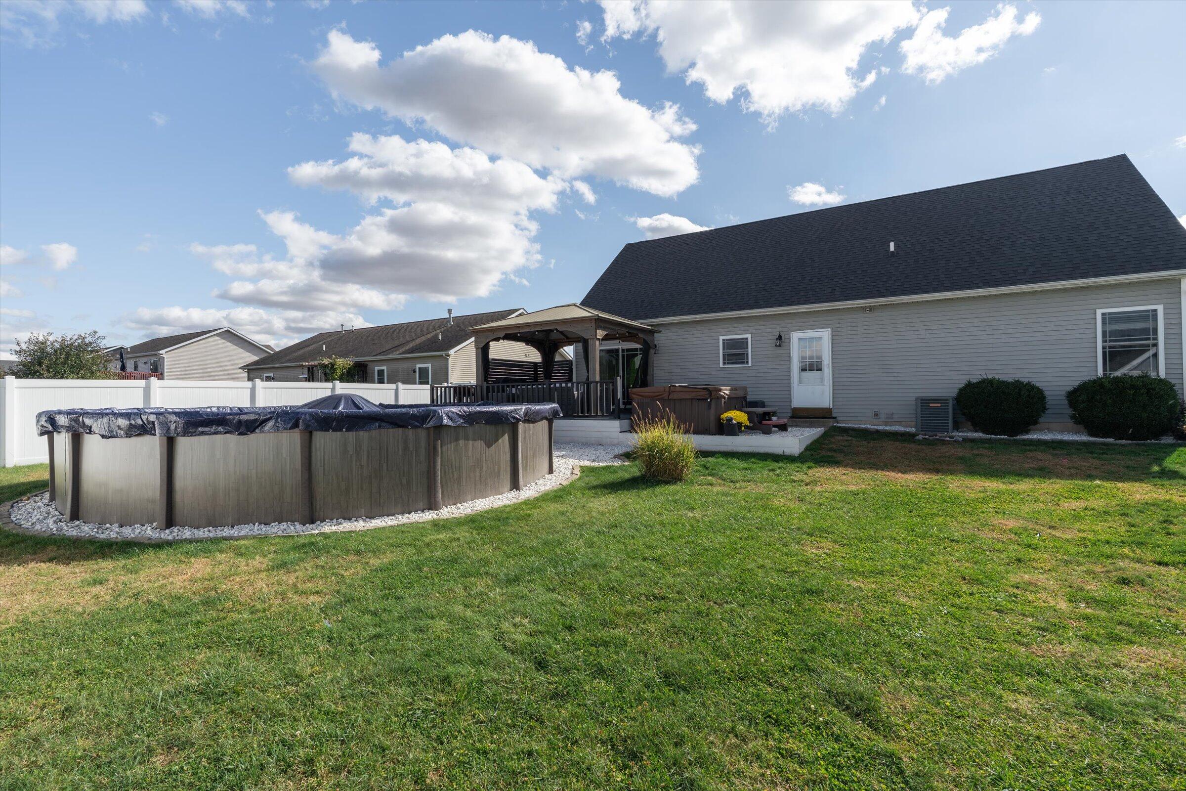 408 Coyote Trail Kouts, IN 46347 - Photo 34 of 36 a view of a house with a backyard