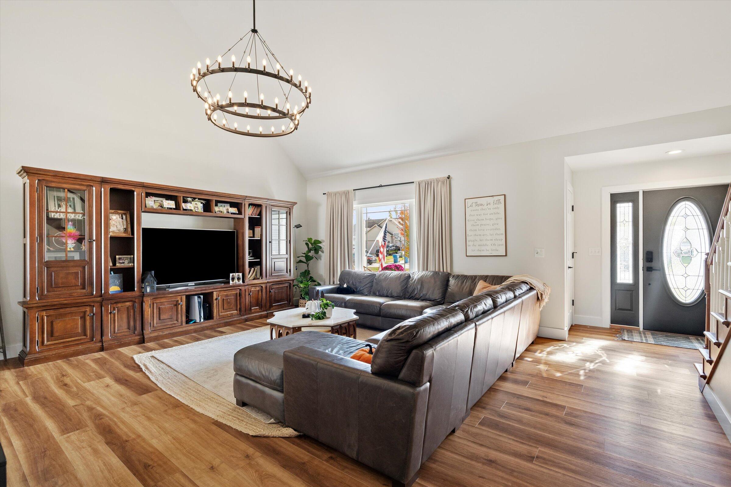 408 Coyote Trail Kouts, IN 46347 - Photo 8 of 36 a living room with furniture and a flat screen tv