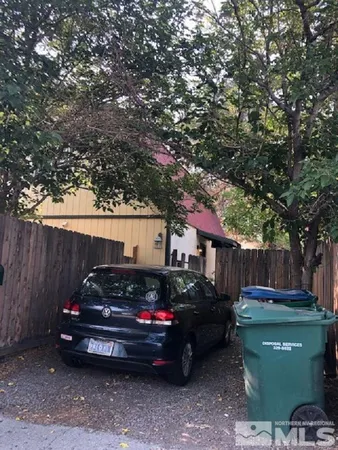a view of a car in front of a house