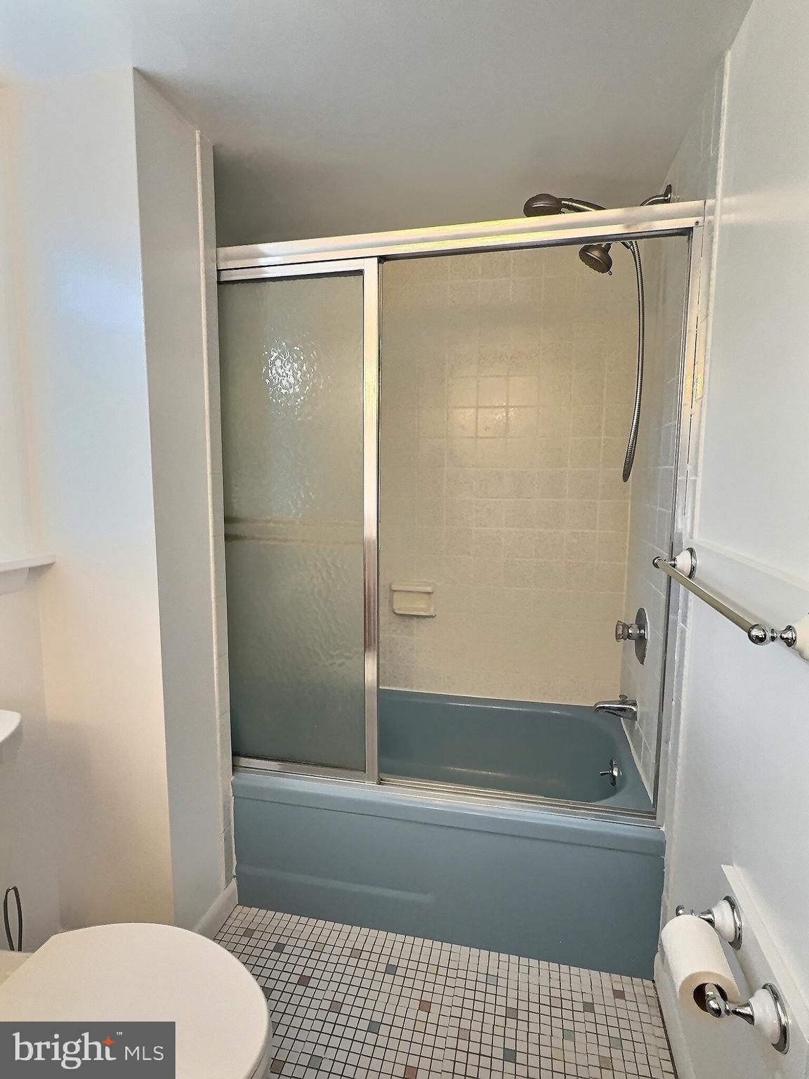 6639 Bucknell Road Bryans Road, MD 20616 - Photo 17 of 28 a bathroom with a shower a bathtub and a toilet