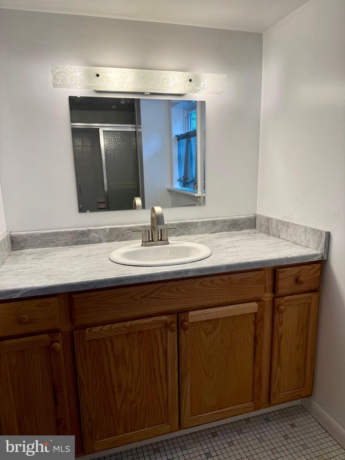 6639 Bucknell Road Bryans Road, MD 20616 - Photo 19 of 28 a bathroom with a sink and a mirror
