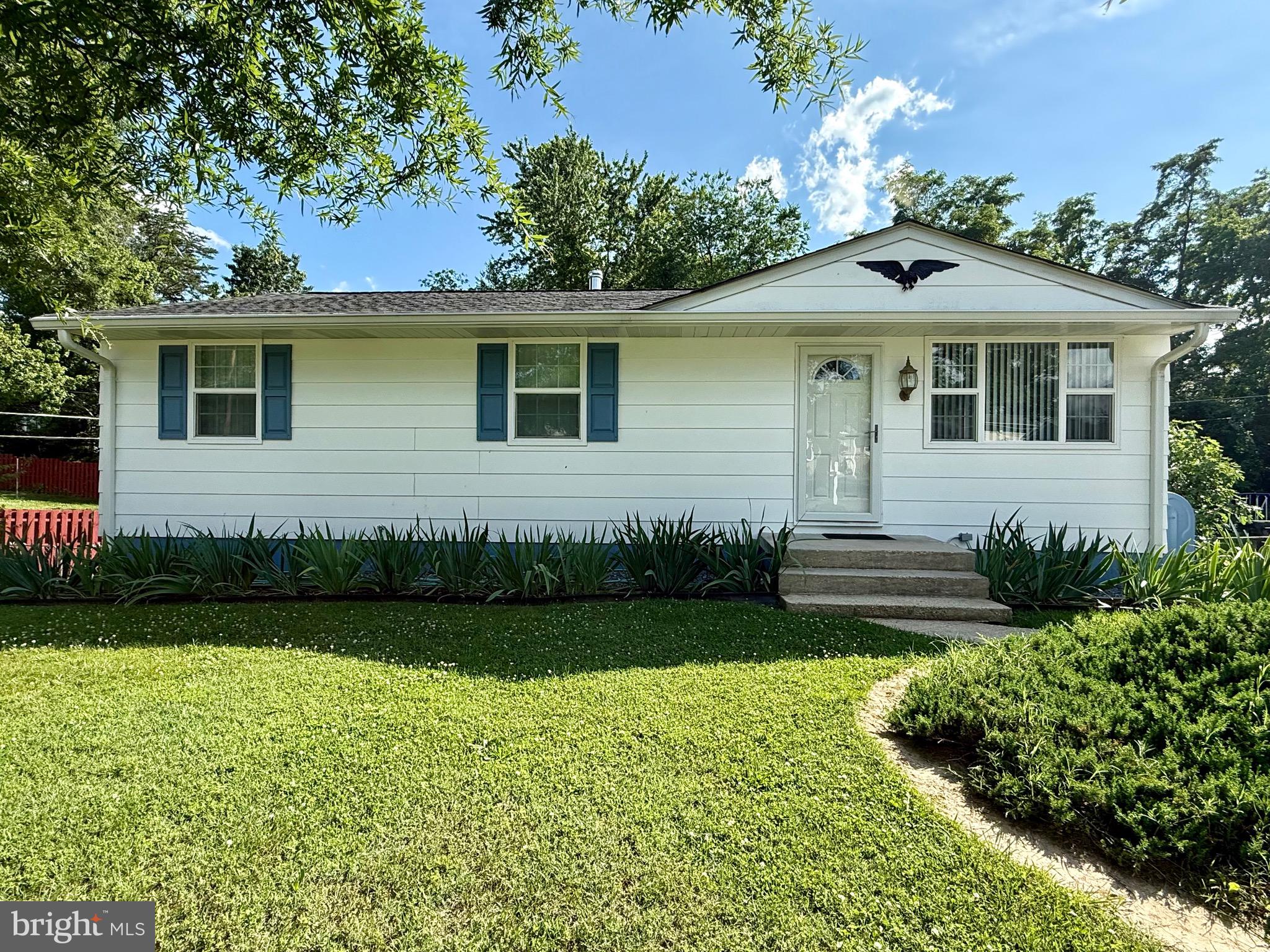 6639 Bucknell Road Bryans Road, MD 20616 - Photo 2 of 28 a front view of a house with garden
