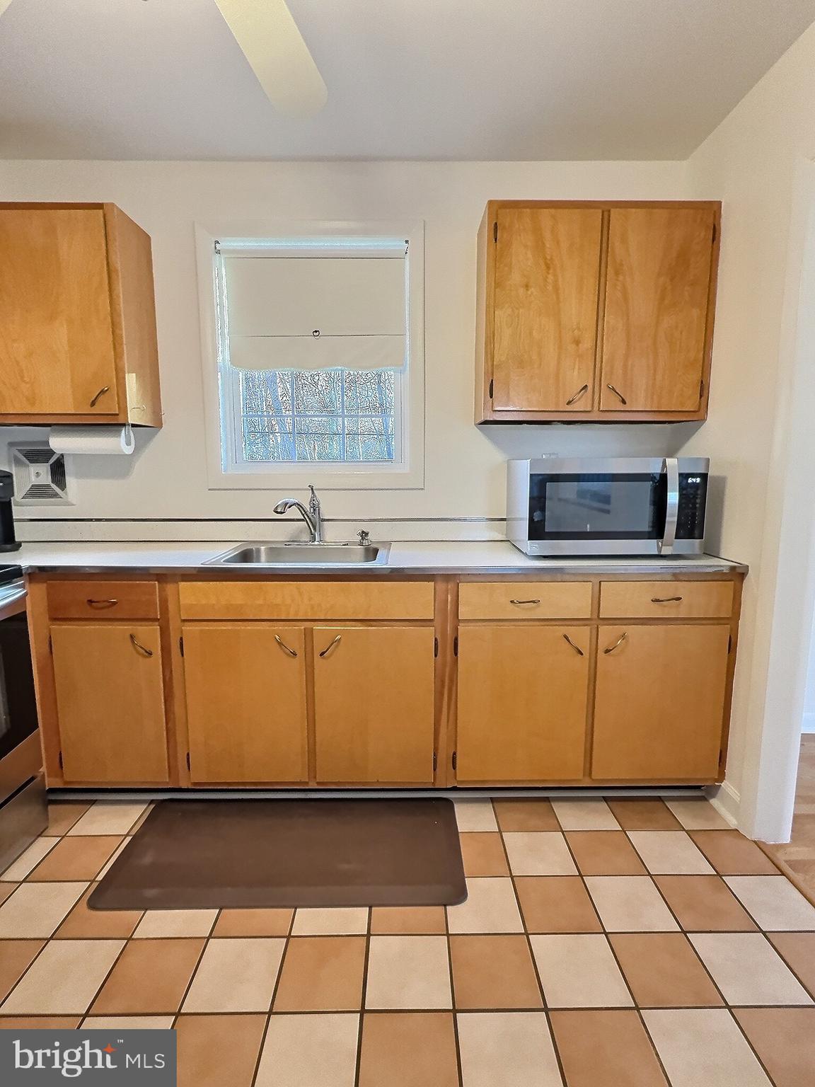 6639 Bucknell Road Bryans Road, MD 20616 - Photo 22 of 28 a view of a kitchen with washing machine cabinets and a sink