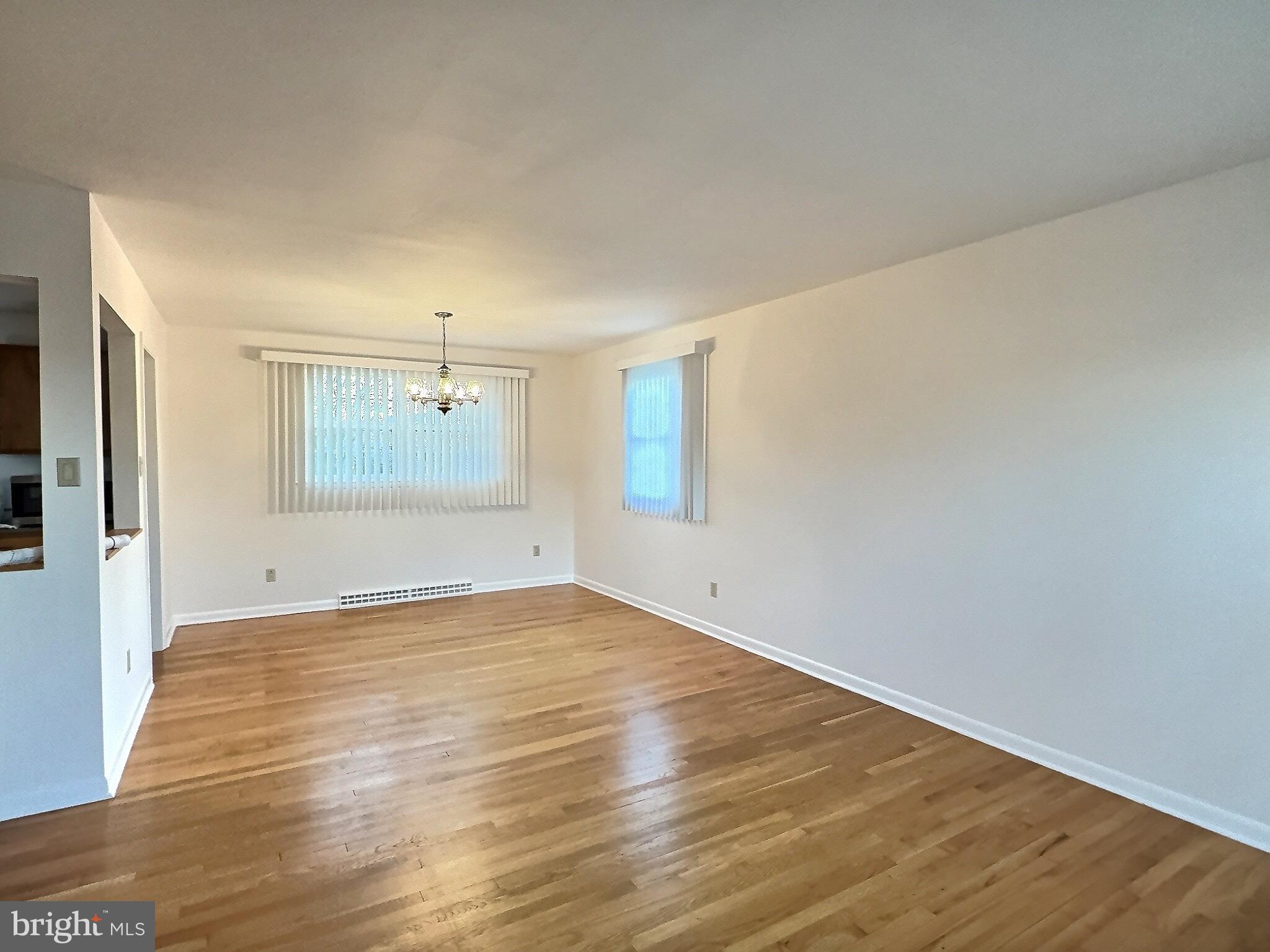 6639 Bucknell Road Bryans Road, MD 20616 - Photo 25 of 28 a view of an empty room with wooden floor and a window