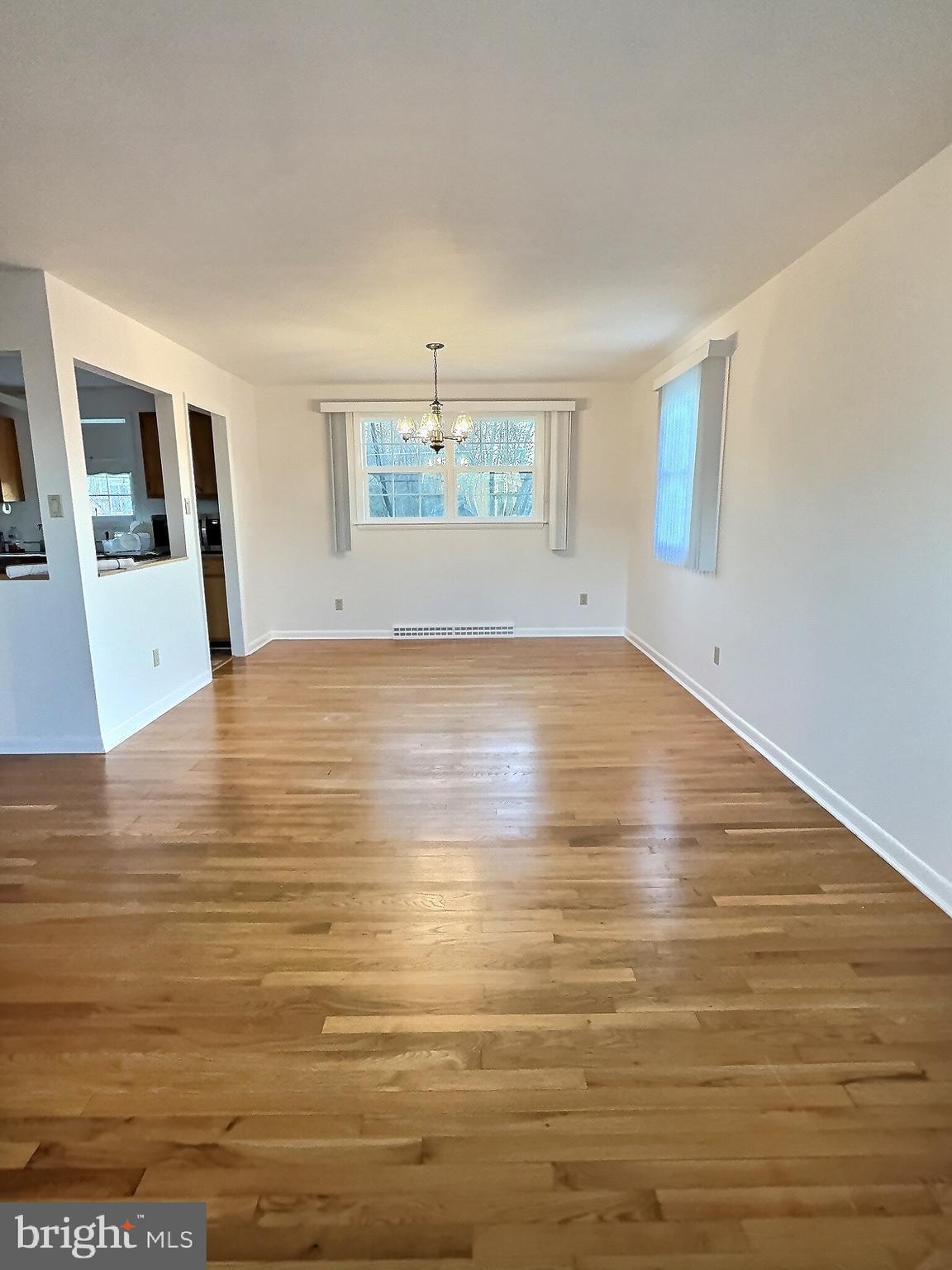 6639 Bucknell Road Bryans Road, MD 20616 - Photo 5 of 28 a view of an empty room with wooden floor and a window