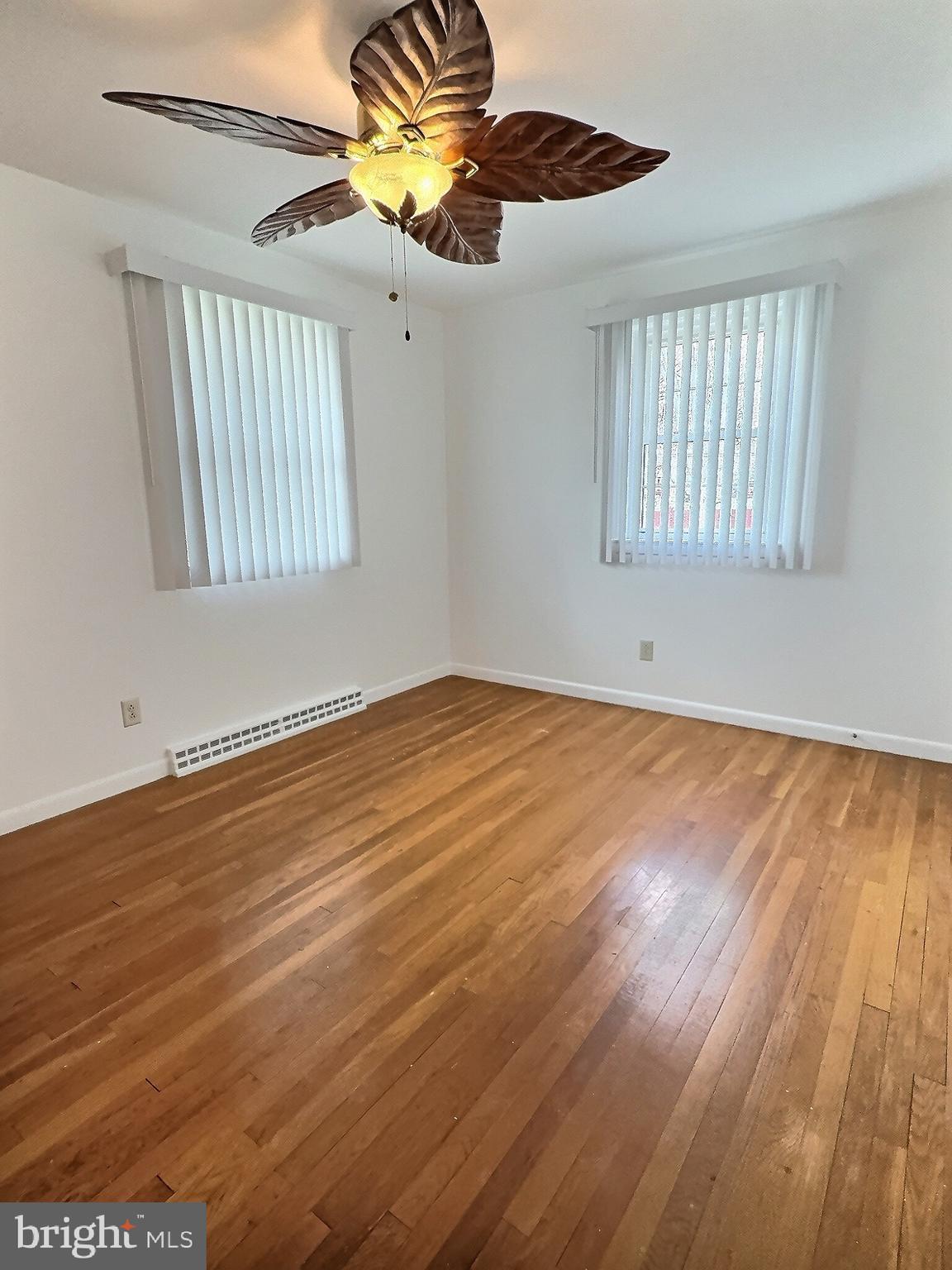 6639 Bucknell Road Bryans Road, MD 20616 - Photo 8 of 28 a view of an empty room with window and wooden floor