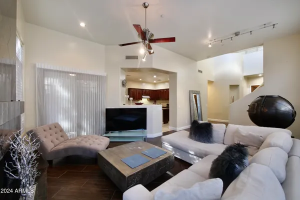 a living room with furniture and a large window