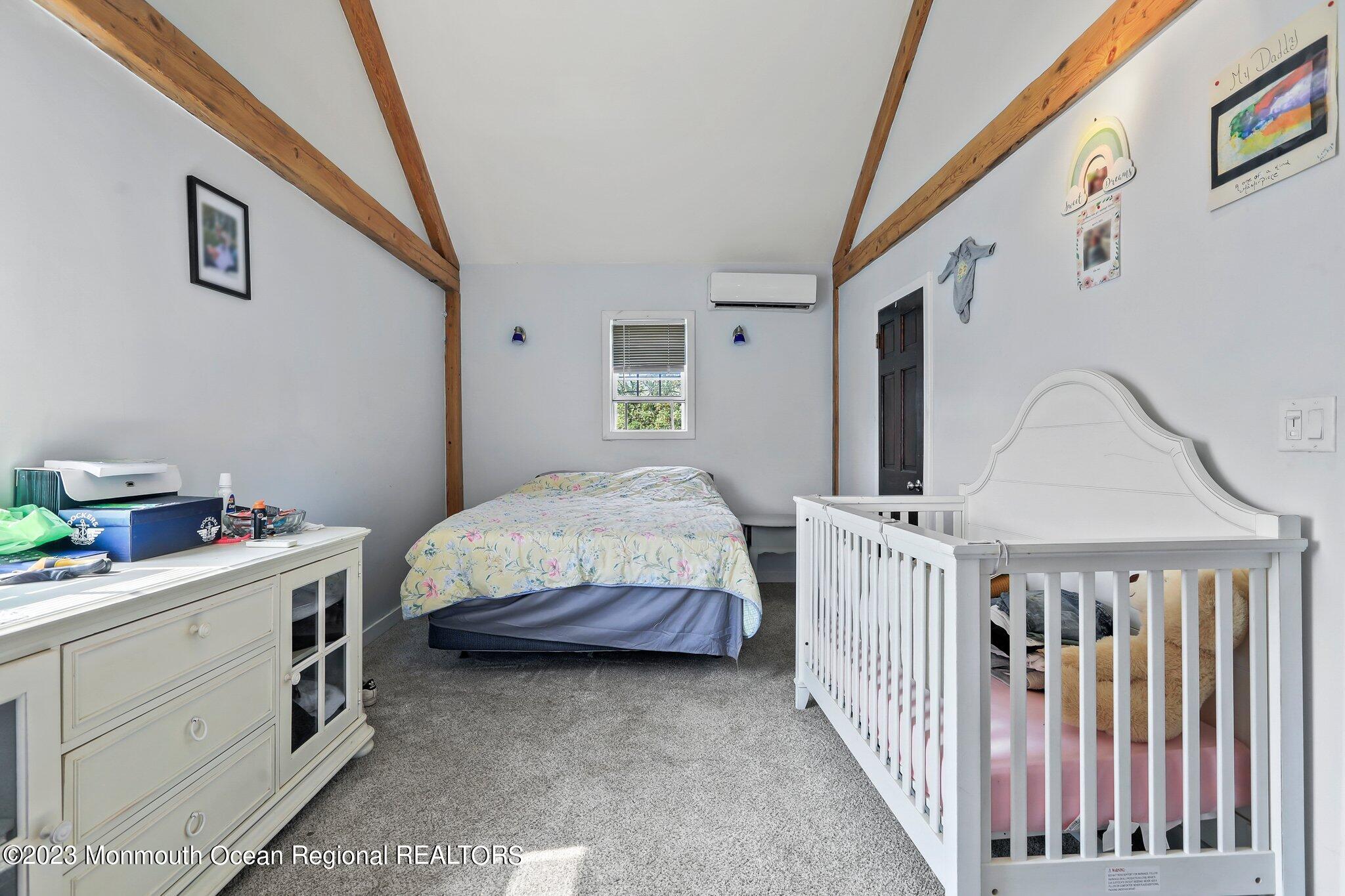 12 5th Street Highlands, NJ 07732 - Photo 16 of 35 a bedroom with furniture and baby crib