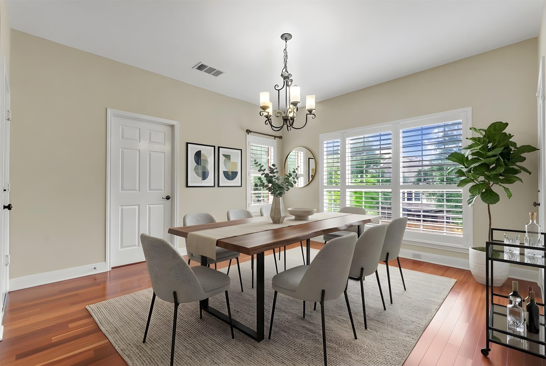 6008 Tributary Ridge Court Austin, TX 78759 - Photo 7 of 36 Virtually staged elegant dining space, ideal for entertaining. Hardwood floors and ample natural light define this inviting interior space.