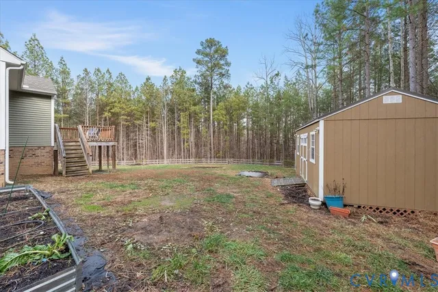 a backyard of a house with lots of green space