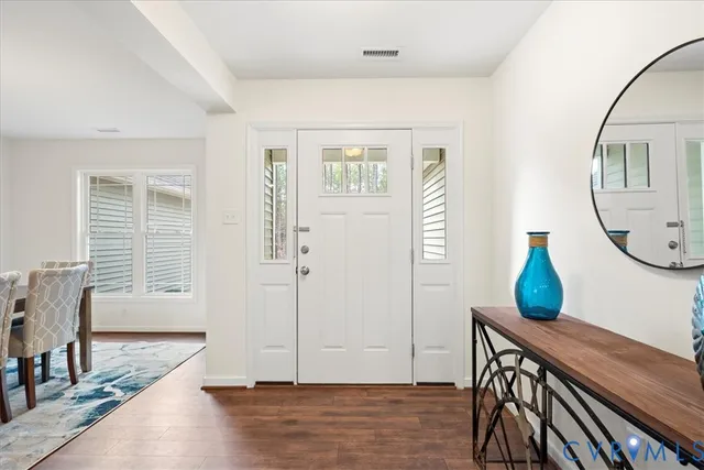 a view of a livingroom with furniture and wooden floor