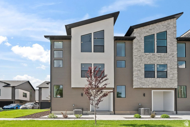 545 East 7215 South Midvale, UT 84047 - Photo 1 of 27 View of front facade featuring stone siding and a front yard