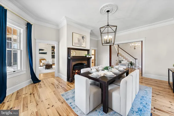 a kitchen with stainless steel appliances granite countertop a lot of counter space and wooden floors