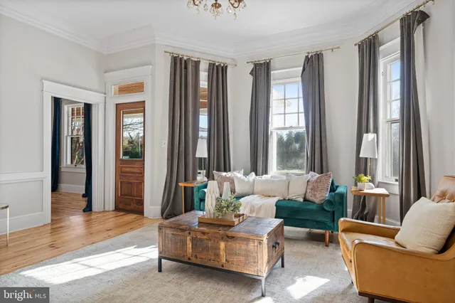 a kitchen with a counter top space a sink stainless steel appliances and cabinets