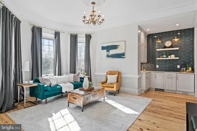 a kitchen with stainless steel appliances granite countertop a stove and a large window