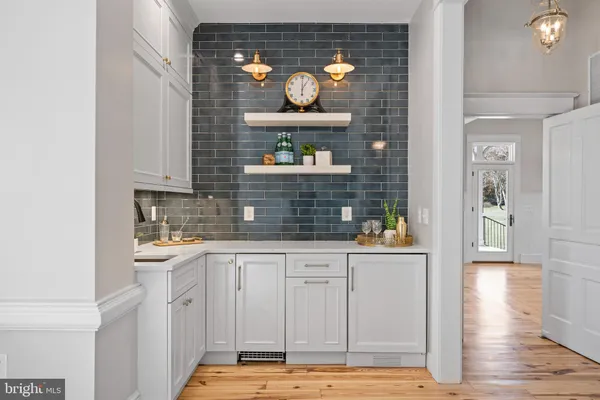 a kitchen with stainless steel appliances granite countertop a stove and a large window