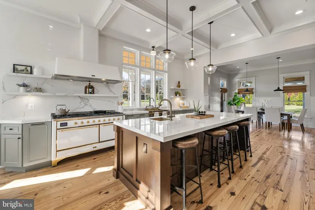 a bath tub sitting next to a white sink and a window