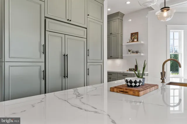 a view of a kitchen with a sink and cabinets
