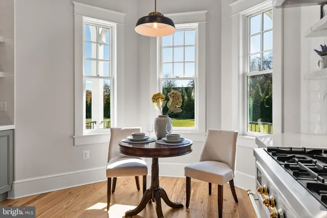 a living room with lots of furniture and a fireplace
