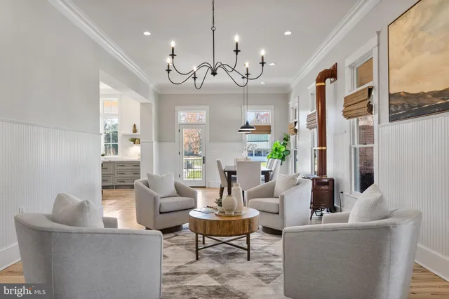 a front view of a house with a yard table and chairs