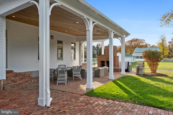 a view of an entryway with wooden floor and a chandelier