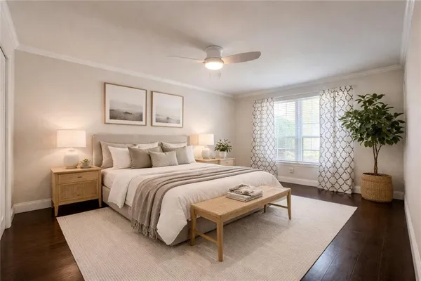 a bedroom with a bed couch and potted plant