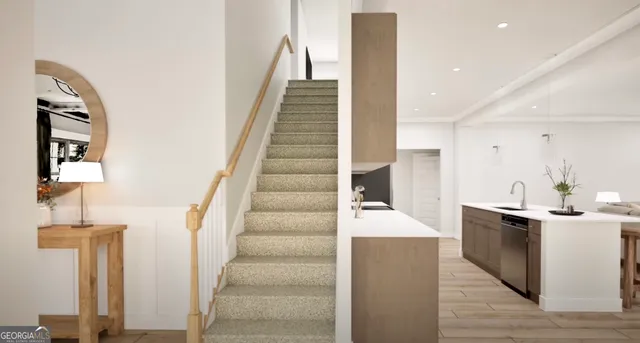 a view of a kitchen with cabinets and wooden floor