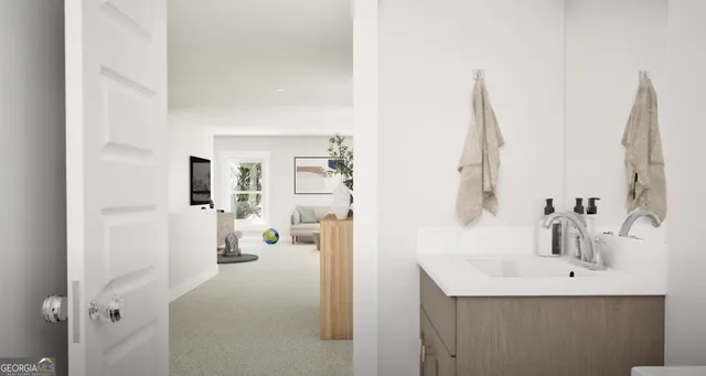 a en suite bathroom with a sink and mirror