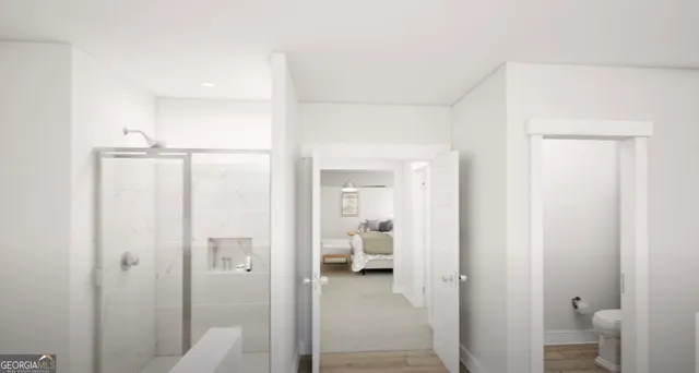 a view of a bathroom from a hallway