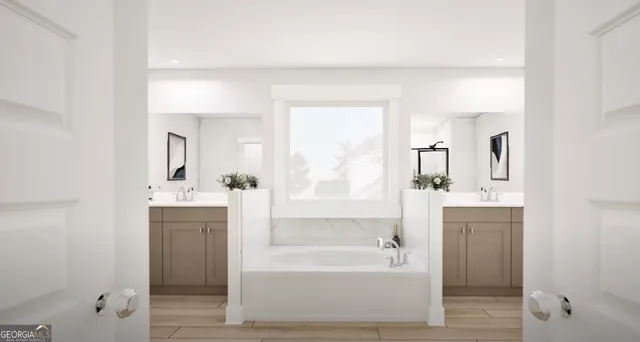 a bathroom with a bathtub and a sink
