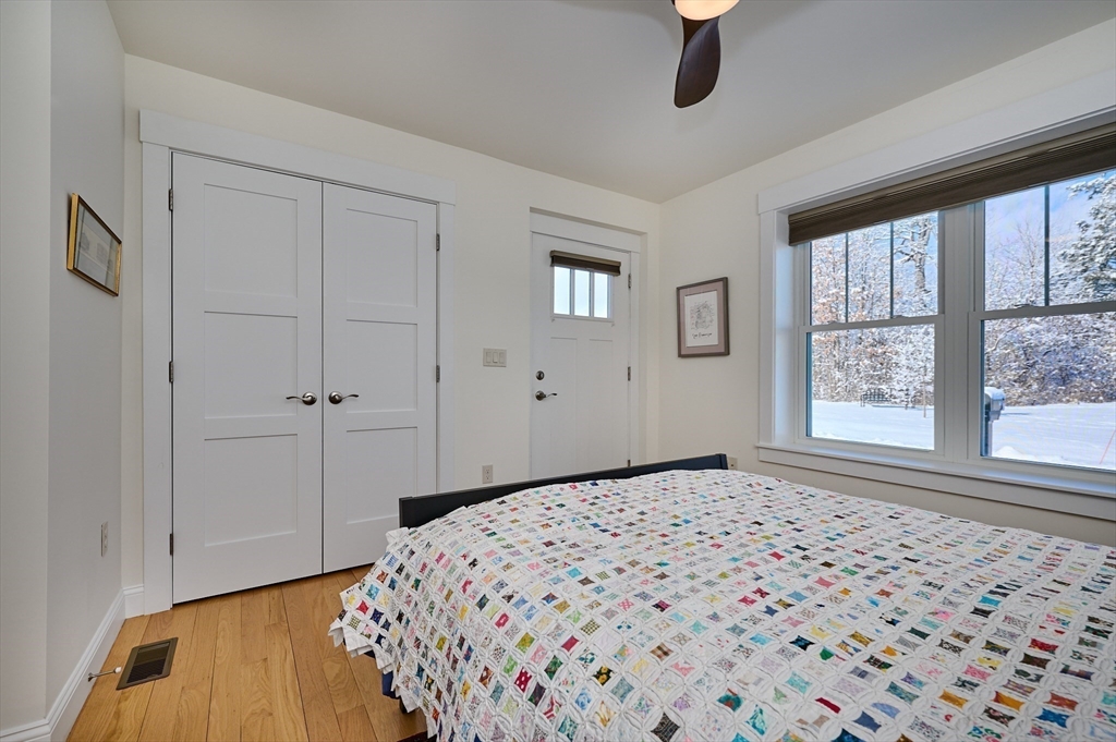 23 Ford Crossing Northampton, MA 01060 - Photo 16 of 34 a bedroom with a bed and a window