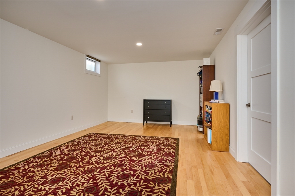 23 Ford Crossing Northampton, MA 01060 - Photo 20 of 34 a view of a bedroom with bed and wooden floor