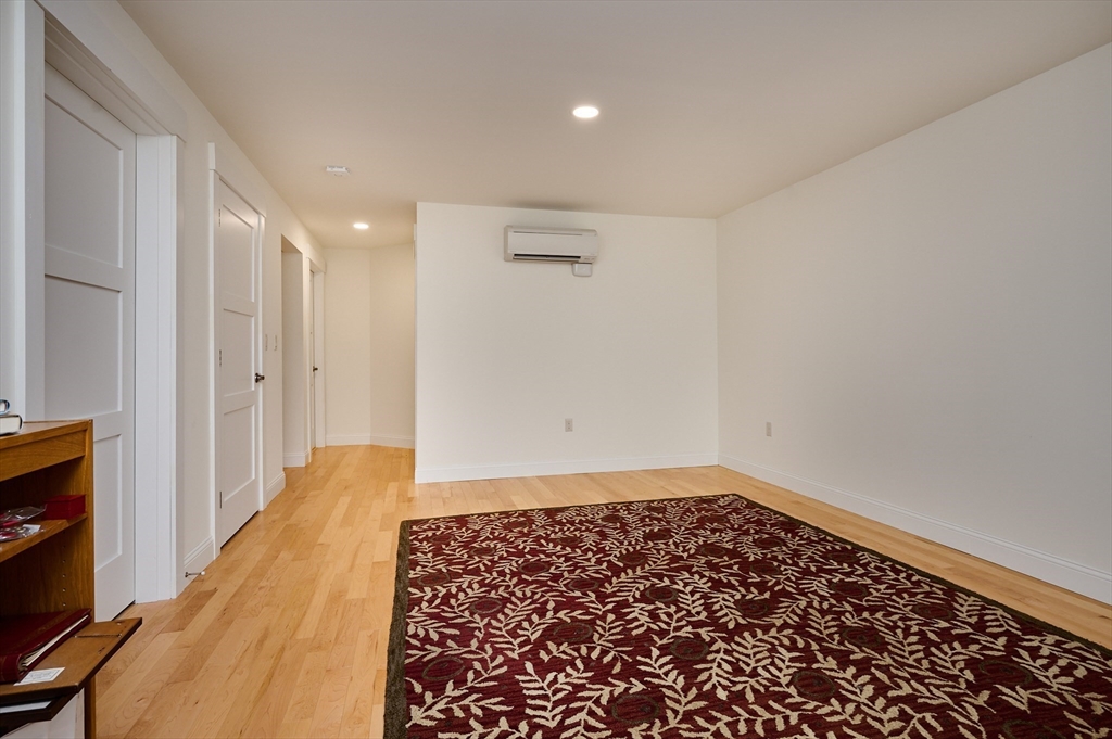 23 Ford Crossing Northampton, MA 01060 - Photo 21 of 34 wooden floor in an empty room with a window