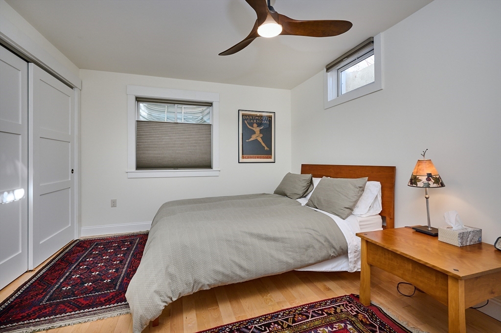 23 Ford Crossing Northampton, MA 01060 - Photo 22 of 34 a bedroom with a bed and a chandelier