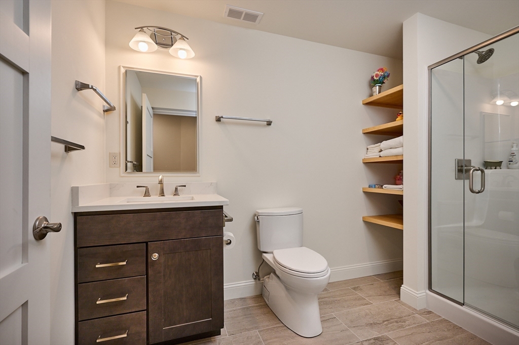 23 Ford Crossing Northampton, MA 01060 - Photo 23 of 34 a bathroom with a toilet sink and mirror
