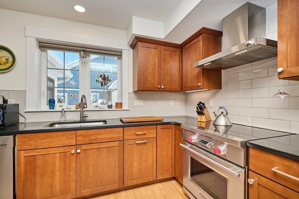 23 Ford Crossing Northampton, MA 01060 - Photo 5 of 34 a kitchen with granite countertop cabinets stainless steel appliances and a sink