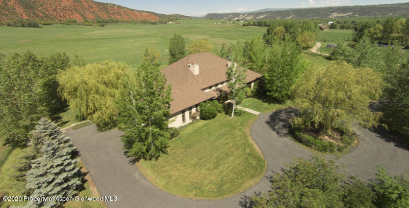 277 Hooks Lane Basalt, CO 81621 - Photo 3 of 3 a view of a lake with a yard