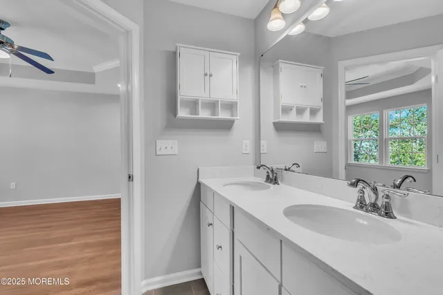 a bathroom with a glass shower door