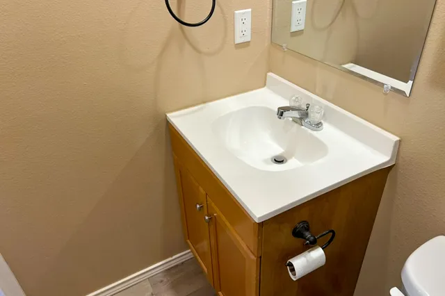 a bathroom with a sink and a mirror