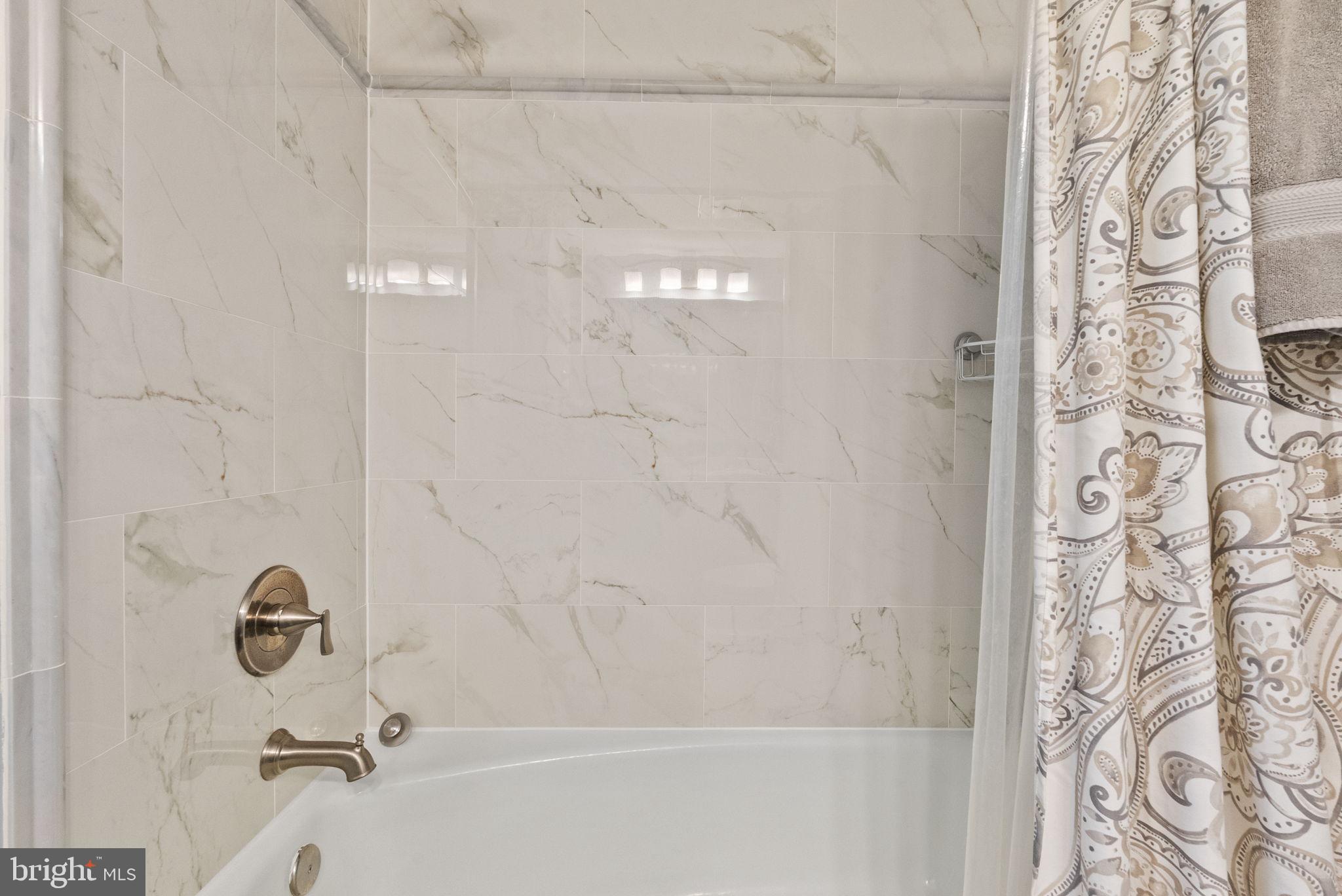 649 C Street Southeast, Unit 304 Washington, DC 20003 - Photo 20 of 37 a bathroom with a shower