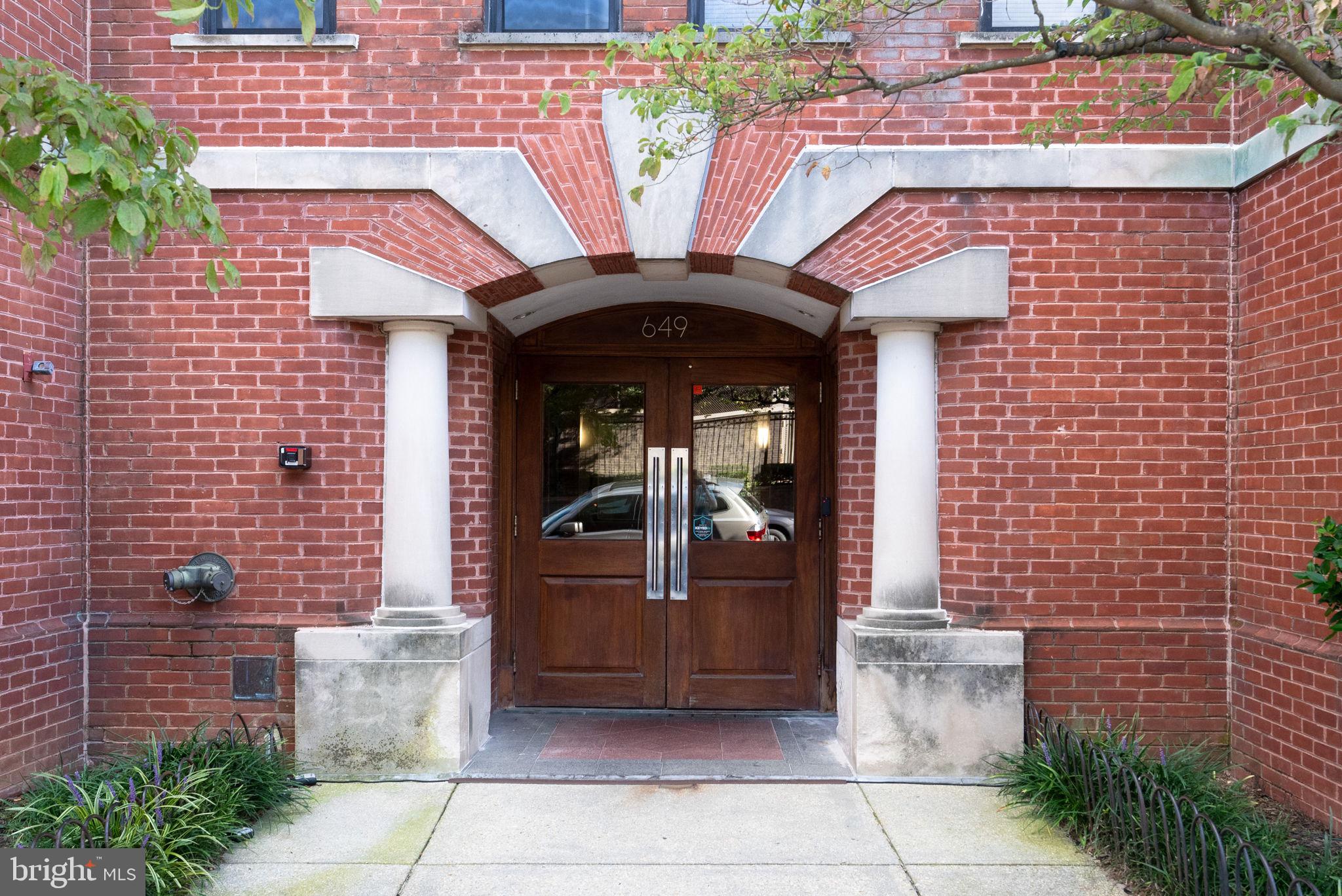 649 C Street Southeast, Unit 304 Washington, DC 20003 - Photo 3 of 37 a front view of a house with glass windows