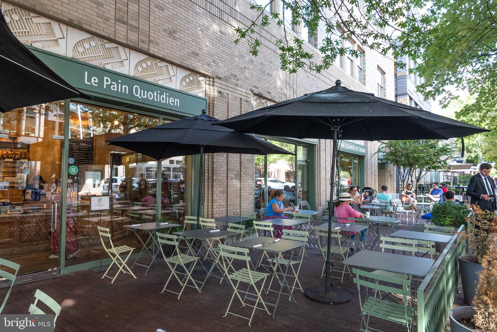 649 C Street Southeast, Unit 304 Washington, DC 20003 - Photo 33 of 37 a view of a chairs and table under an umbrella in patio