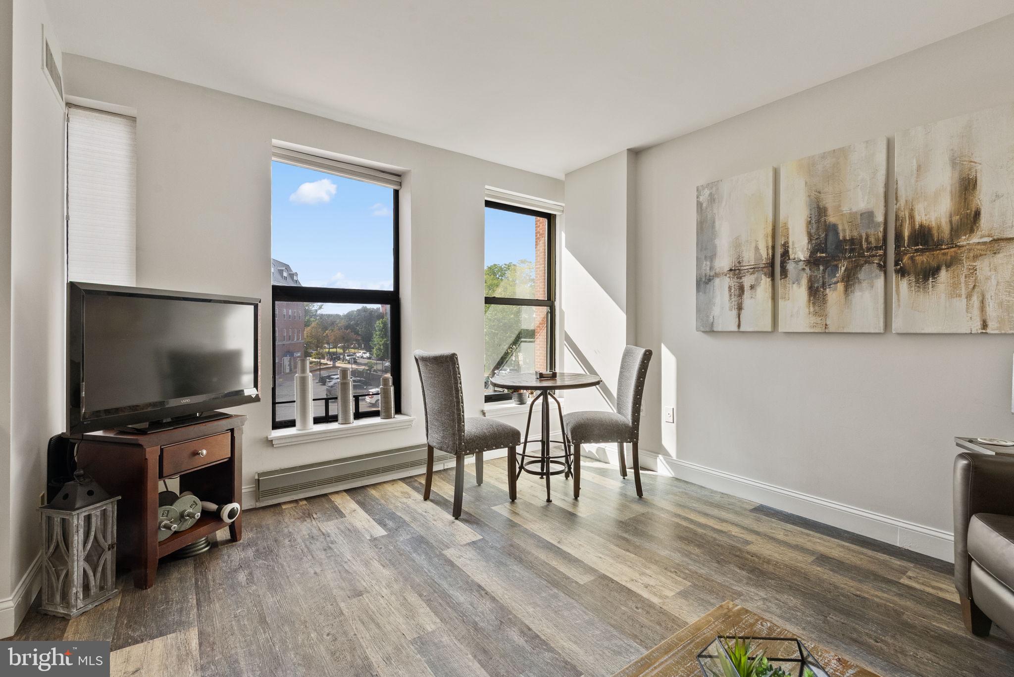 649 C Street Southeast, Unit 304 Washington, DC 20003 - Photo 8 of 37 a view of a livingroom with furniture and a flat screen tv