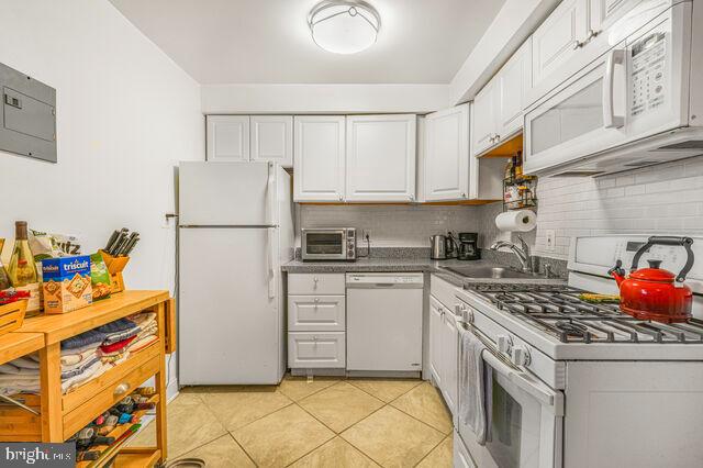 1633 D Street Southeast Washington, DC 20003 - Photo 15 of 38 a kitchen with a sink appliances and cabinets