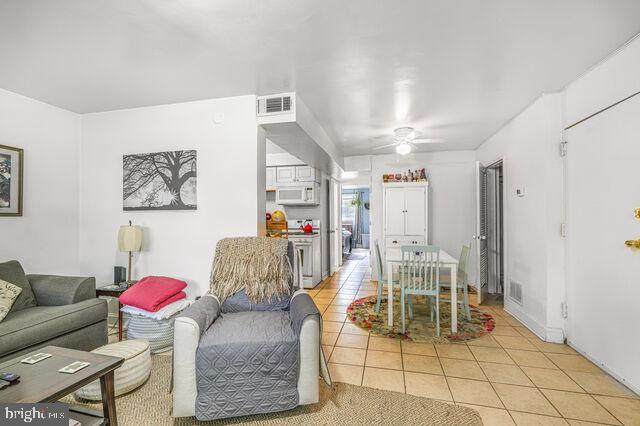 1633 D Street Southeast Washington, DC 20003 - Photo 16 of 38 a living room with furniture and a table