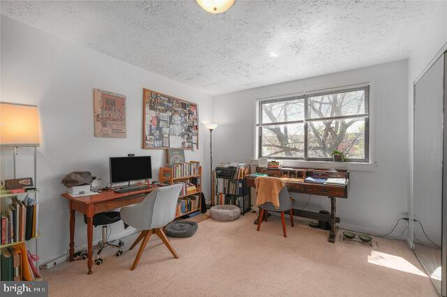 1633 D Street Southeast Washington, DC 20003 - Photo 19 of 38 a view of a workspace with furniture and a window