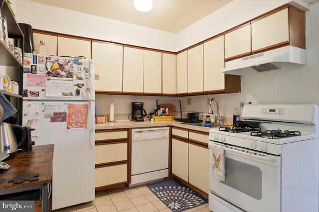 1633 D Street Southeast Washington, DC 20003 - Photo 21 of 38 a kitchen with stainless steel appliances granite countertop a stove a sink and a refrigerator